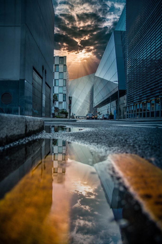 reflection of buildings in wet street